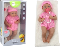 Babypop in roze outfit met mutsje, speen en dekentje
