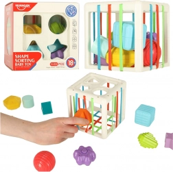 Elastische sensorische kubus met vormindoener