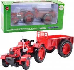 Metalen rode tractor met aanhanger 1:18