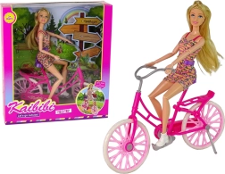 Pop op een roze fiets