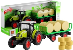 Groene tractor met aanhanger en hooibalen met licht en geluid 37,5 cm