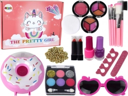 Make-upset voor kinderen met nagellakken, oogschaduw en accessoires in donutbox