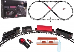 Treinbaan met rokende locomotief, licht en geluid