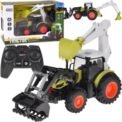 Op afstand bestuurbare tractor met graafmachine en lader