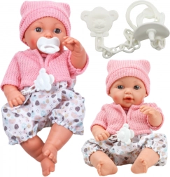 Stoffen pop met een muts en geluiden