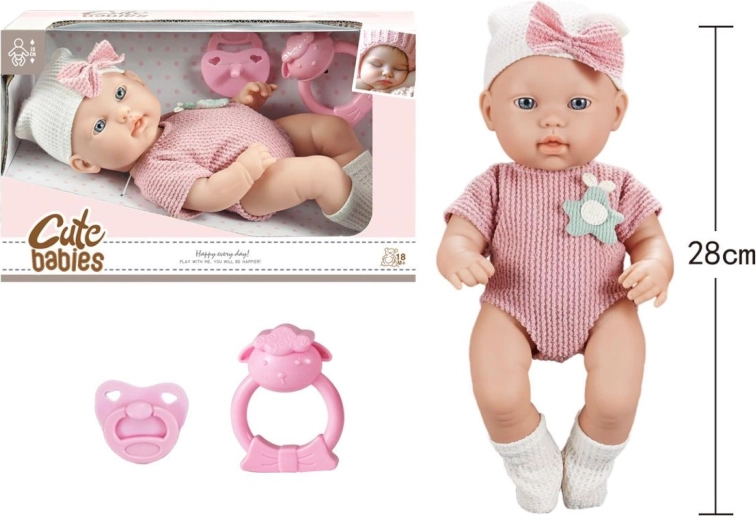 Baby met fopspeen en rammelaar