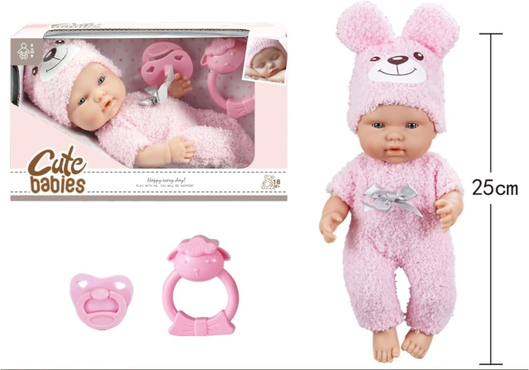 Baby met speen en rammelaar in roze kruippakje