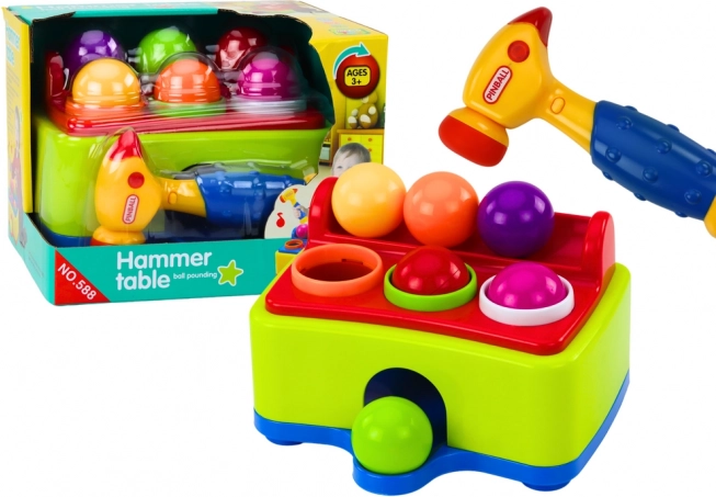 Interactieve hamertafel voor kinderen met knikkers en hamertje