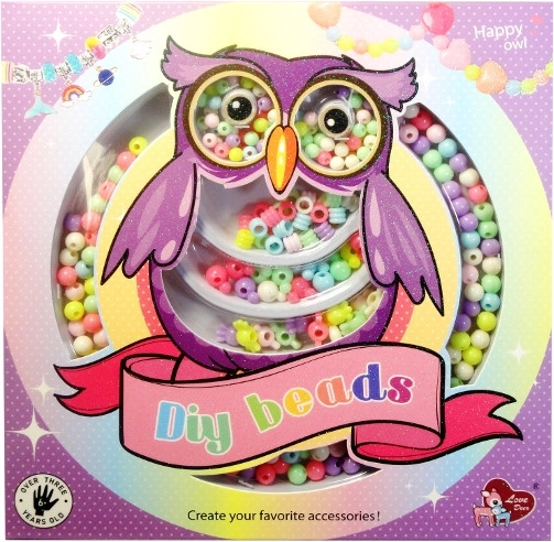 Kralen voor het maken van armbandjes in een doosje in de vorm van een uil
