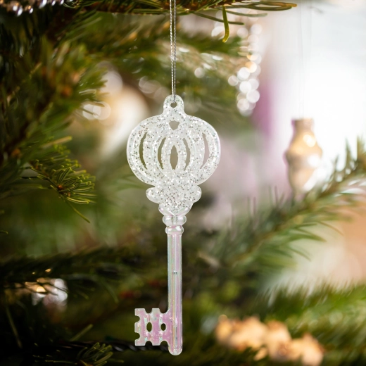 Kerstornament in de vorm van iriserende acrylschaatsen