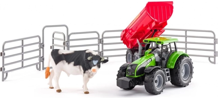 Tractor met aanhanger, stier en omheining voor kinderen