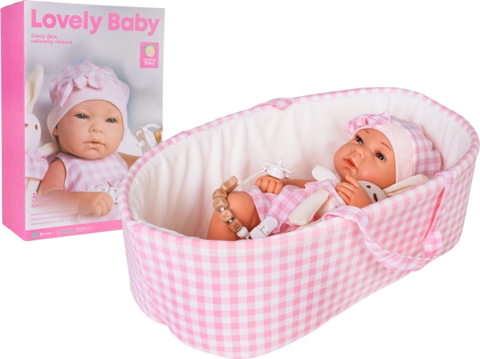 Babypop in roze draagmand