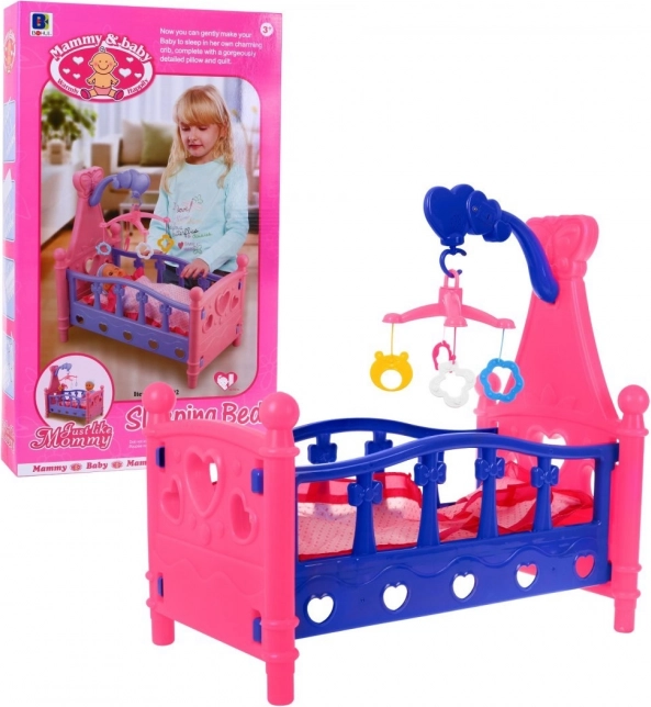 Poppenbedje met mobiel en beddengoed, 3+