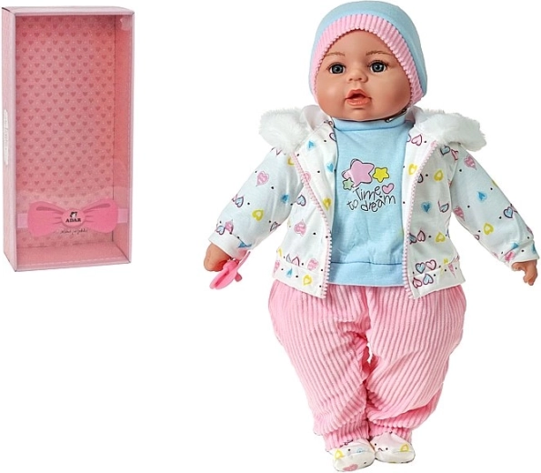 Pratende en zingende babypop in geschenkdoos