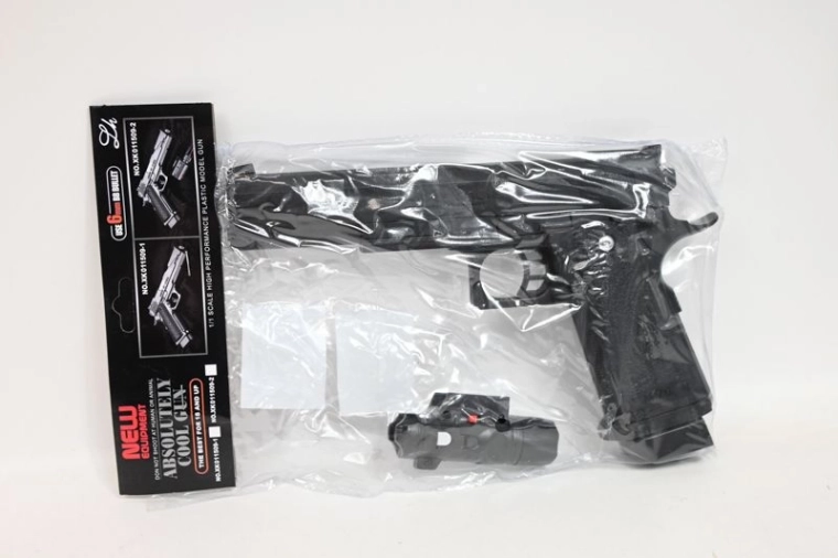 Kinderknikkerpistool met licht in zakje