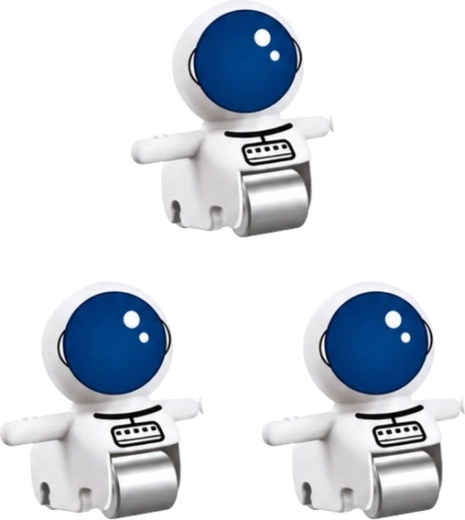 Drie astronautenfiguren in de verpakking