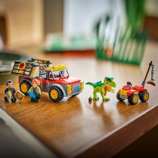 Vang de baby T. rex en vervoer hem veilig