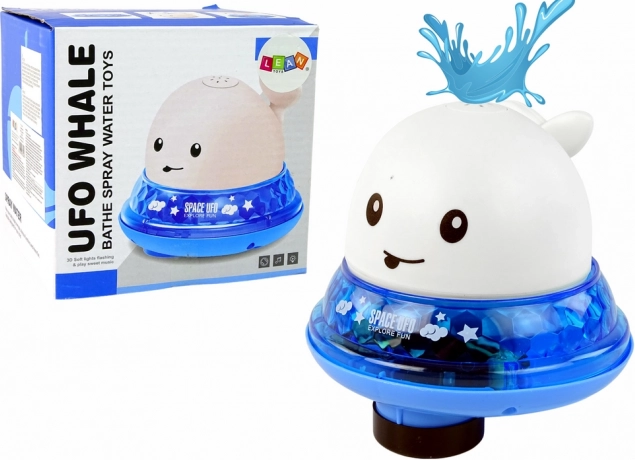 Witte walvis spuitend water met standaard badspeelgoed