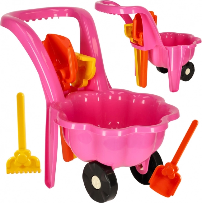 Roze kinderkruiwagen met set voor in het zand Stokrotka – schep en hark