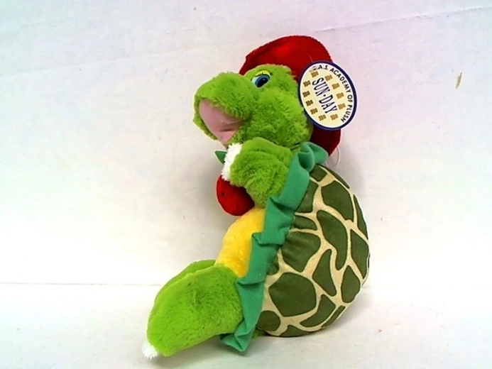 Pluchen schildpad met rode hoed en appel