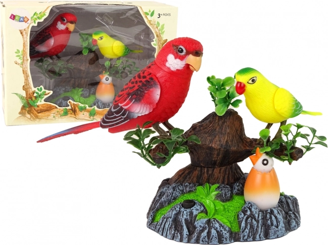 Zingende bewegende papegaaien op een kleurrijke boom