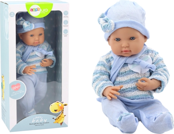 Babypop in blauw gestreept truitje met mutsje en sjaal