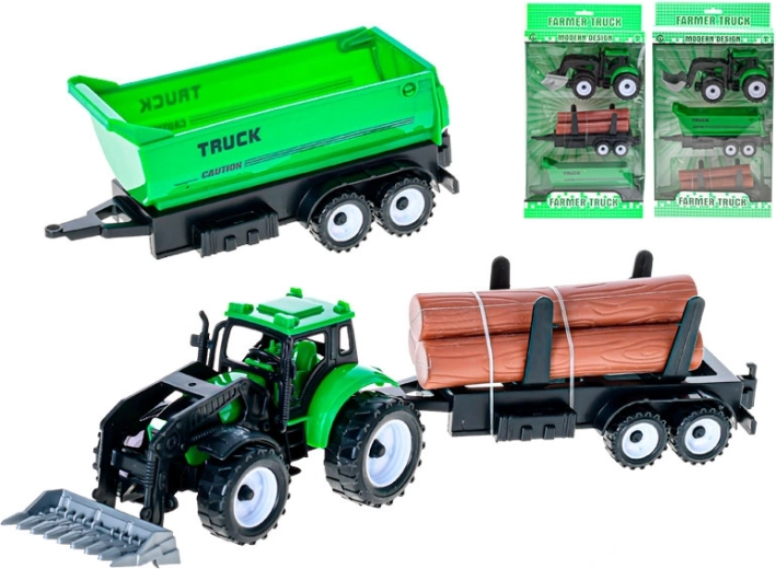 Groene tractor met voorlader en 2 verwisselbare aanhangers met vliegwiel