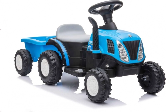 Blauwe kindertractor op accu met aanhanger