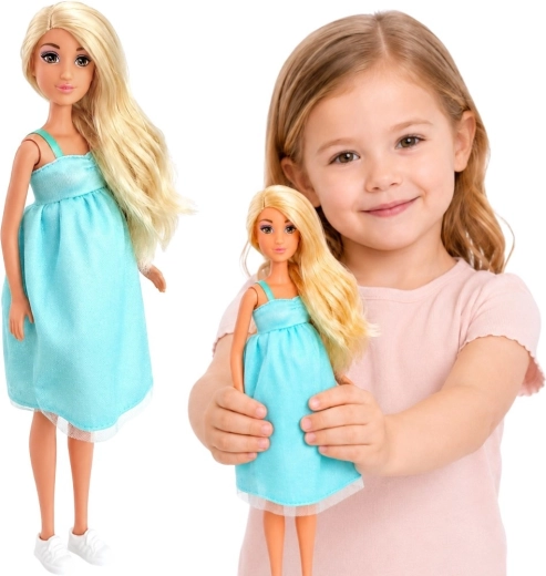 Zwangere pop Lily Woopie Royal met baby in blauwe jurk