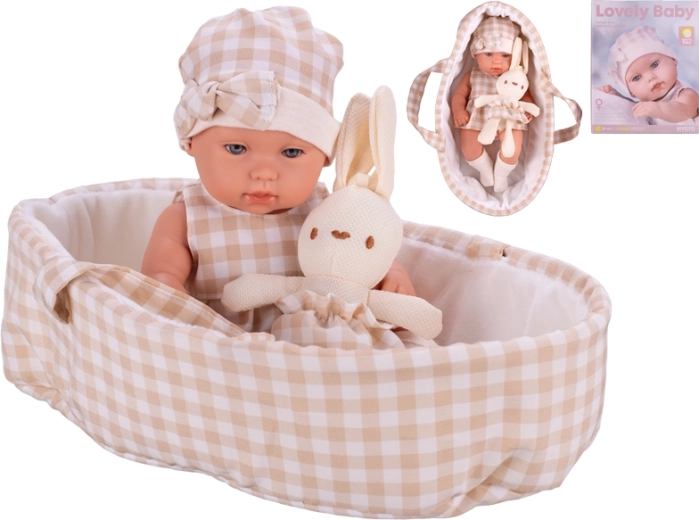 Pop van 33 cm met hard lijfje, draagmand en pluche konijntje