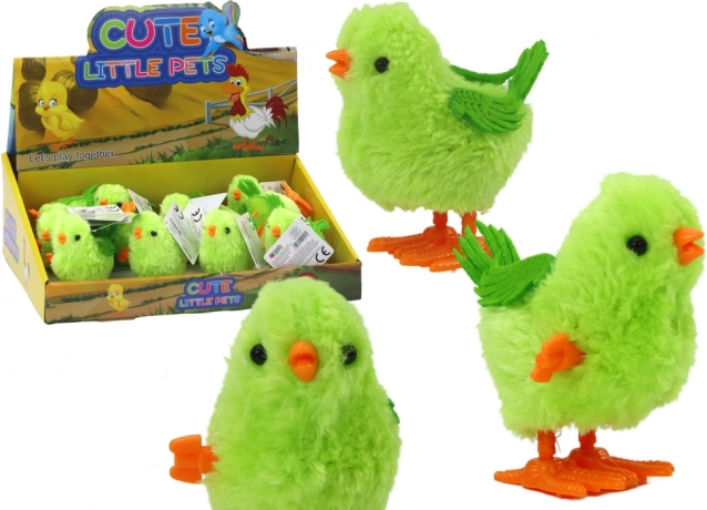 Springende opwindbare speelgoedkip groen