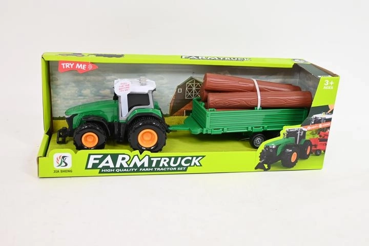 Tractor met aanhanger en boomstammen