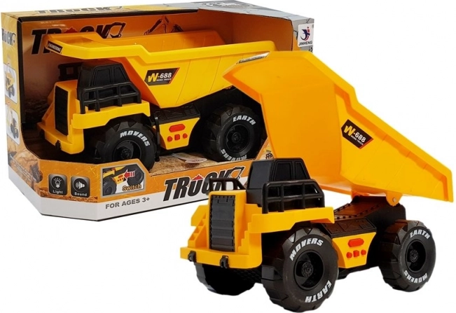 Gele kinderspeelgoed-kiepwagen met wrijvingsaandrijving, licht en geluid