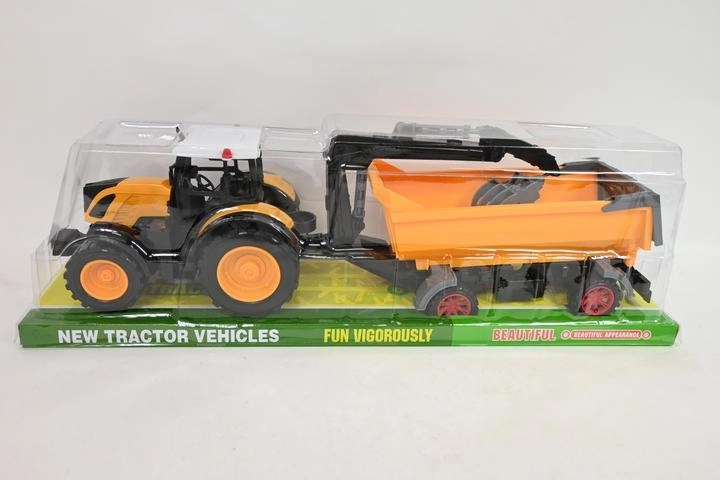 Tractor met aanhanger en laadgrijper