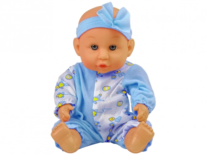 Poppenbaby op potje met blauwe strik