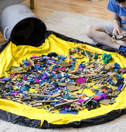 Grijze speelgoedmand met speelkleed