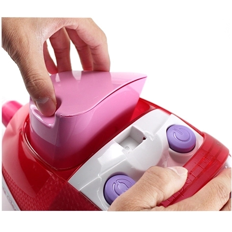 Roze kinderstofzuiger met zuigfunctie