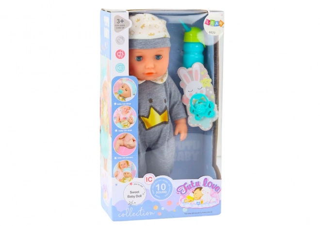 Interactieve babypop in grijze pyjama