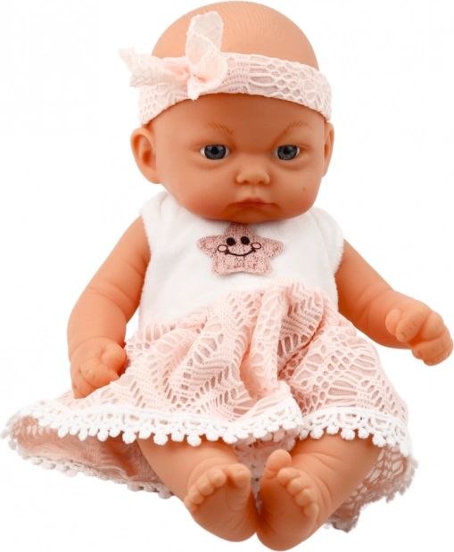 Babypop in roze jurk met haarband