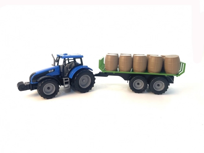Tractor met vliegwiel en aanhanger vol hooi