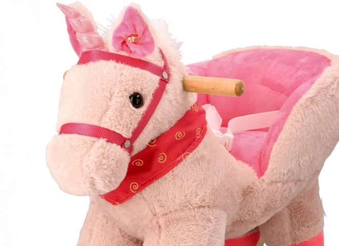 Roze eenhoorn met autostoel
