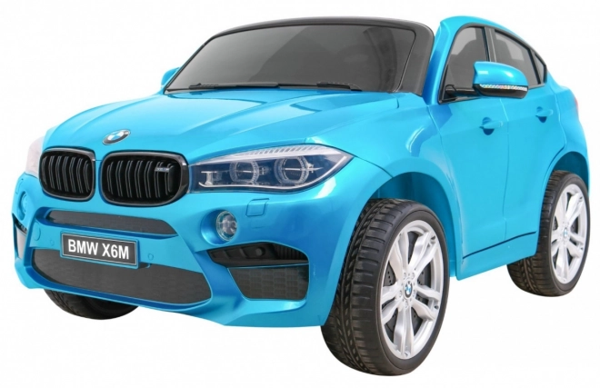 BMW X6M XXL pro 2 kinderen Blauwe kleur + Afstandsbediening + Eco-leer + Veiligheidsgordels + Langzame start + MP3 + LED