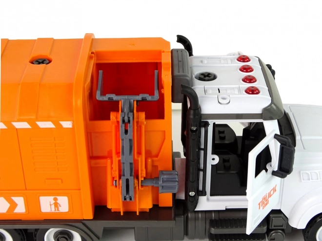 Oranje afvalwagen met schroef- en draaibare accessoirekit