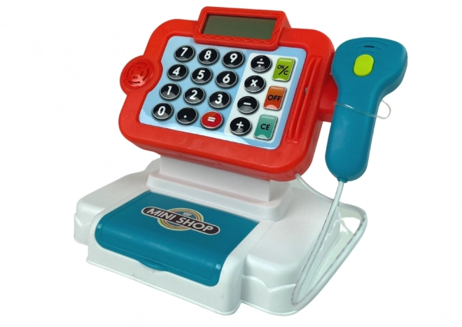 Kinderspeelkassa met rekenmachine en groentemand