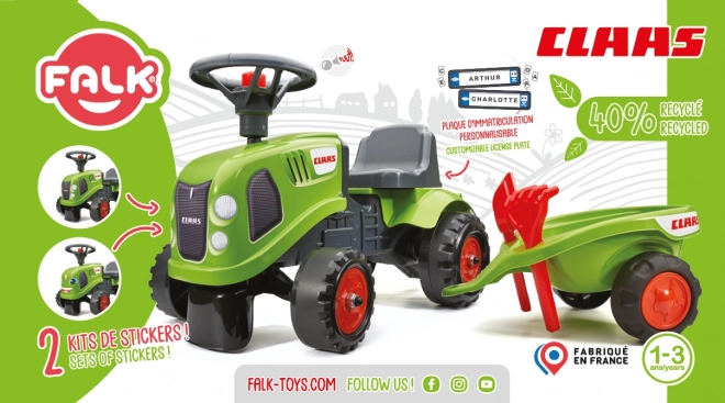 Duwtractor Claas groen met stuur en aanhanger
