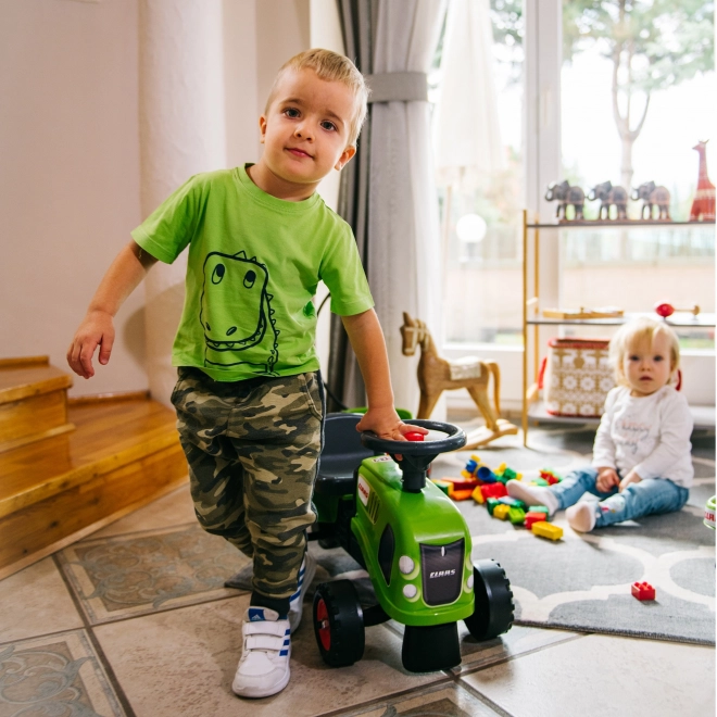 Duwtractor Claas groen met stuur en aanhanger
