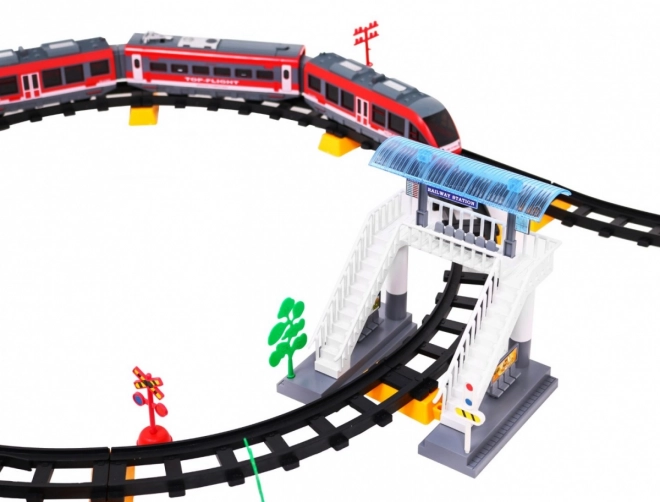 Afstandsbediende trein + hellingen + accessoires - 62 delen