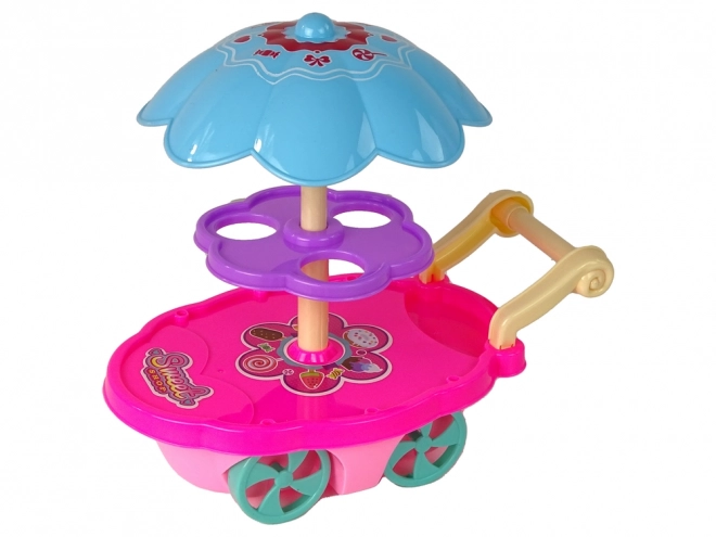 Kinderkraampje met speelgoed - ijscokar
