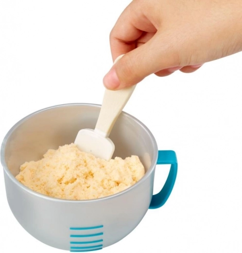 Maatbeker met schaalverdeling en spatel voor precies mengen