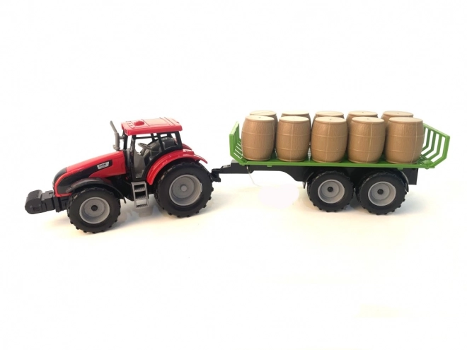 Tractor met vliegwiel en aanhanger vol hooi